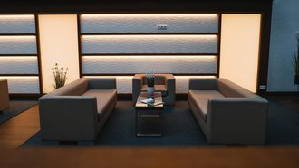 Lounge-Bereich im SportPark mit beleuchteter Wand, zwei Sofas und einem kleinen dekorierten Couch-Tisch dazwischen